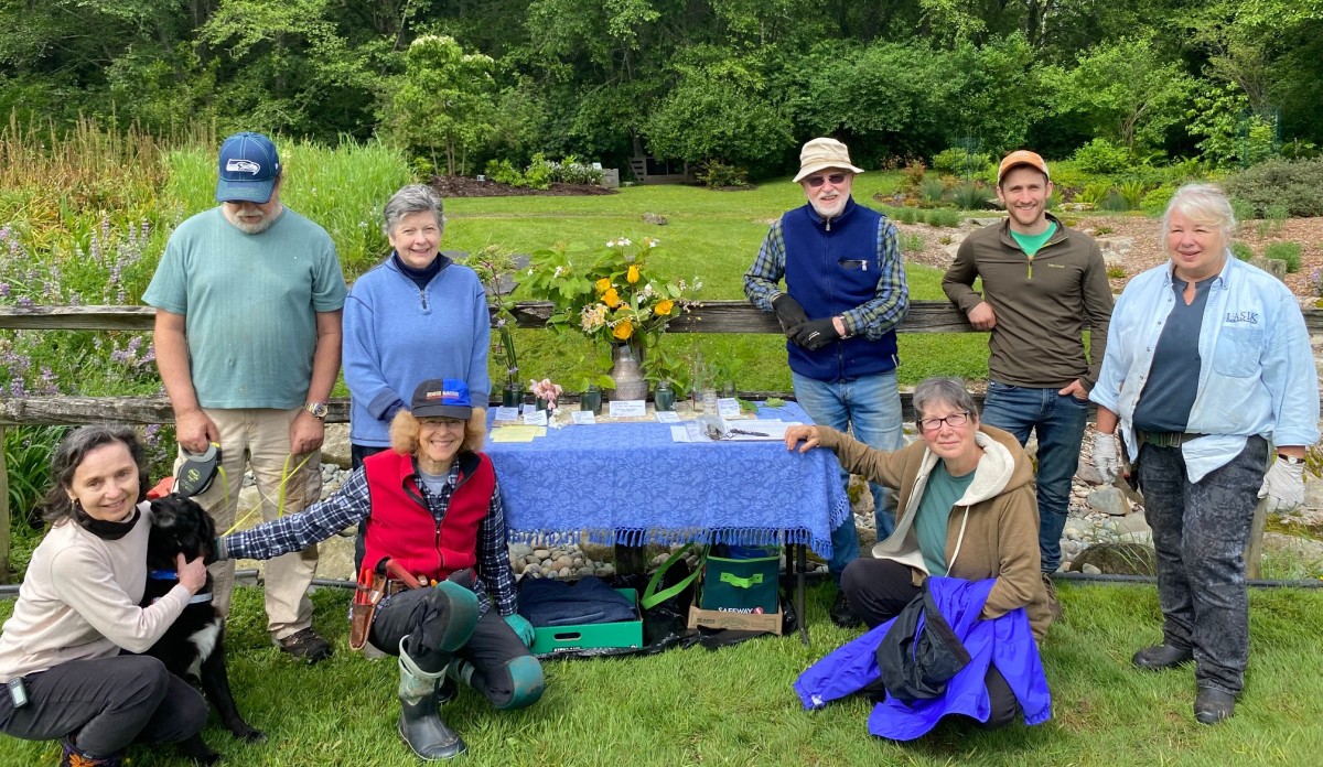 Volunteers take a break on a work party in June